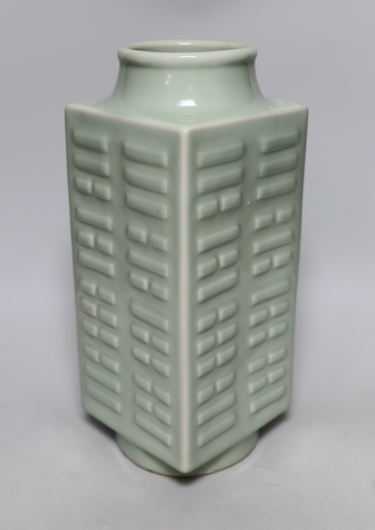 A square Chinese celadon-glazed 'cong' style vase, 30cm tall